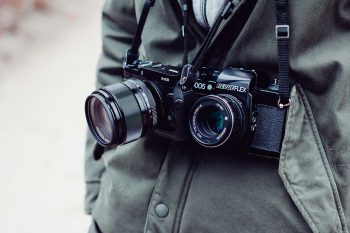 A person wearing two cameras to illustrate Google updating the CameraX library for Android mobile developers with improved dual camera functionality.