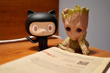 GitHub Octocat reading a newspaper after news that the company will offer data residency, starting with EU developers.