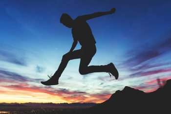Person leaping illustrating the open-source database advancements in PostgreSQL 17 for developers.